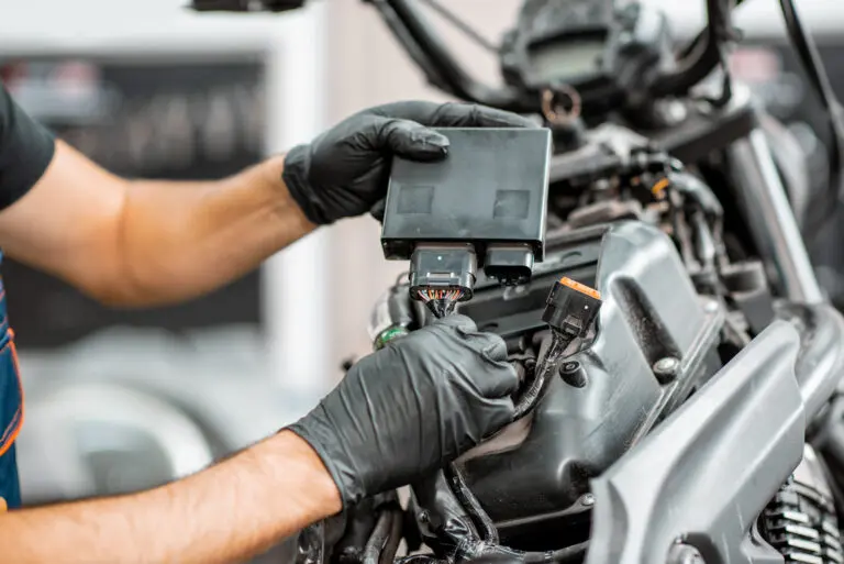 Electrician repairing motorcycle wiring