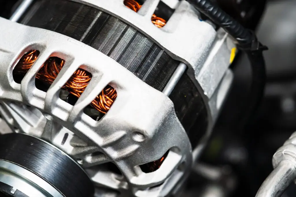 Close up of an alternator installed in a car