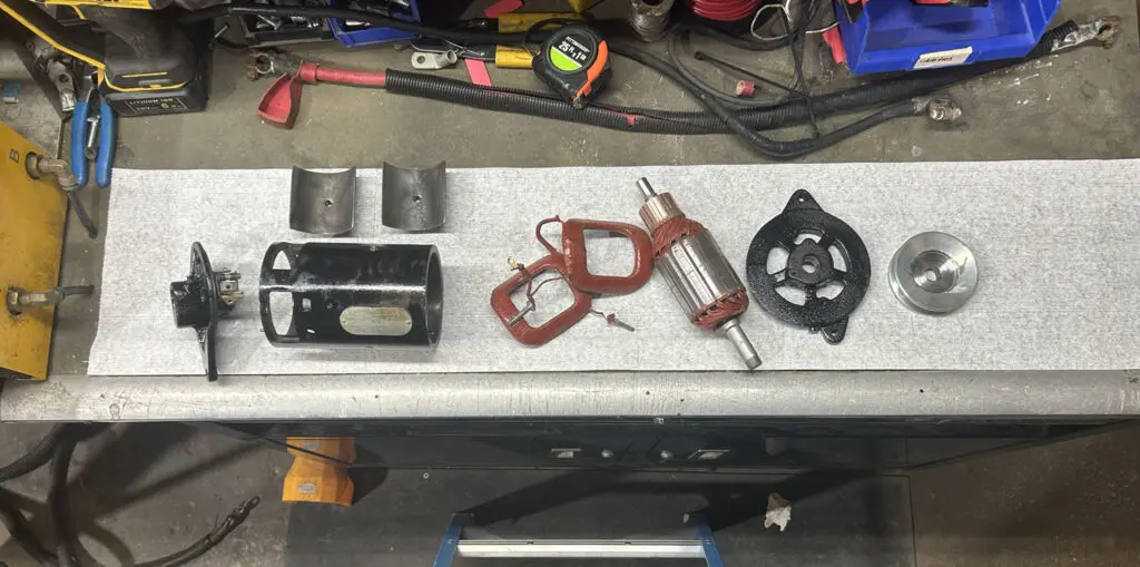 An Automotive Generator taken apart for repairs and cleaning