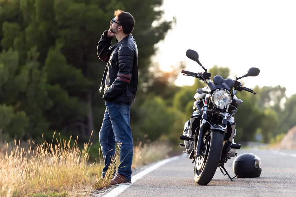 Sturgis-Biker-stuck-on-the-side-of-the-road-in-the-black-hills-calling-for-help