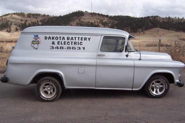 Classic Car With Dakota Battery Signage