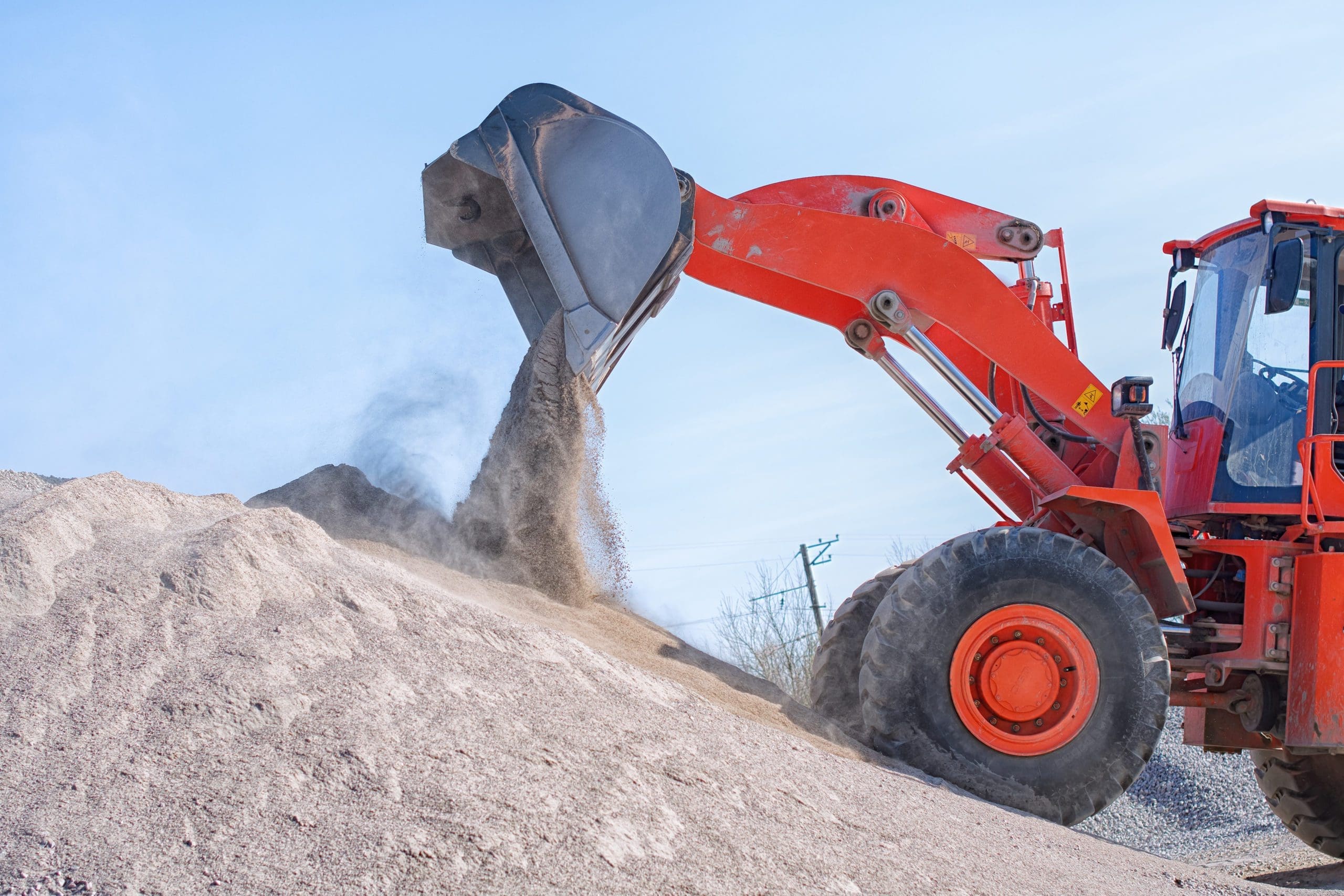 Heavy equipment digging dirt