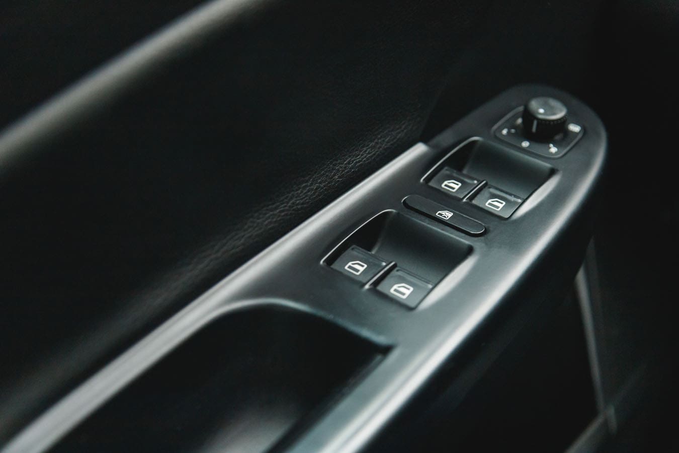 Close up of electric window, power window, controls in a vehicle.